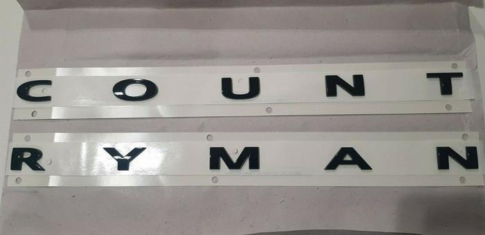 51149852046_A Original MINI F60 Countryman Piano Black Logo Tanda Kata Tulisan Countryman Emblem Belakang Hitam - Gambar 1